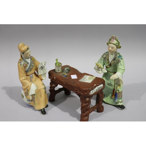 170 - Two Chinese figures with a table, approx 22cm H and shorter (3)