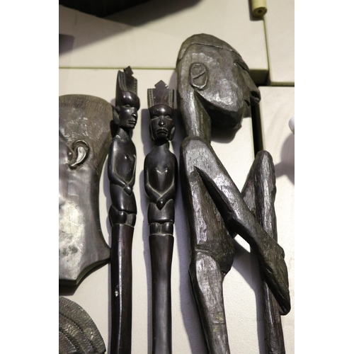 195 - Early Native carved wooden figure along with a spoon and fork, wall hanging head profiles  etc  , ap... 
