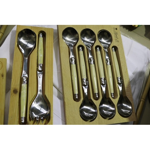 192 - Laguiole and Laguiole style cutlery and utensils, Soup spoons, butter knives, breadknife, salad serv... 