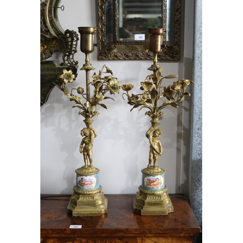 64 - Pair of 19th century ormolu figural candelabras, Sevres porcelain mounted bases, central electric li... 