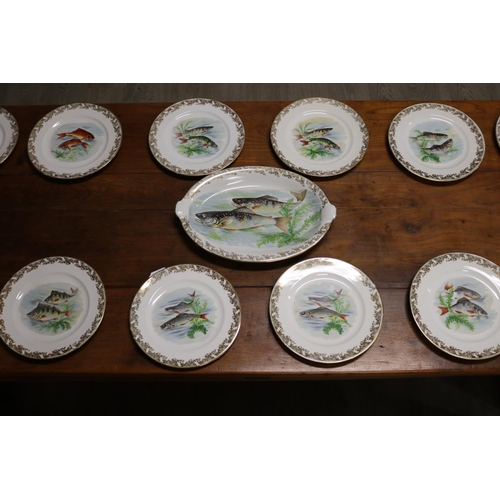 18 - French Limoges porcelain fish service comprising of twelve plates & platter, all pieces with fish mo... 