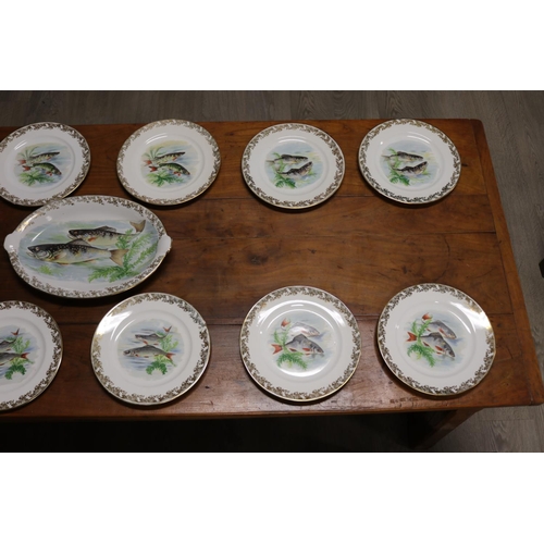18 - French Limoges porcelain fish service comprising of twelve plates & platter, all pieces with fish mo... 