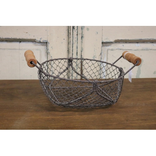56 - French twin handled wire egg basket, approx 14cm H including handls x 31cm W