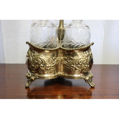 29 - Antique three bottle silver plate tantalus, approx 45cm H