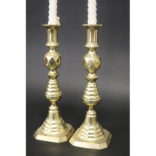 81 - Pair of antique brass candlesticks, each approx 30cm H (2)