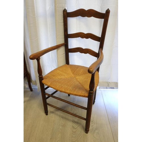 40 - Antique French provincial ladder back armchair with rush seat, approx 101cm H x 51cm W