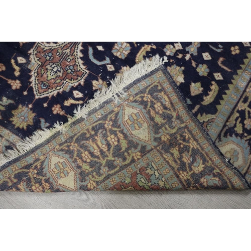 146 - Persian hand knotted wool carpet, royal blue ground with central medallion, approx 127cm x 190cm