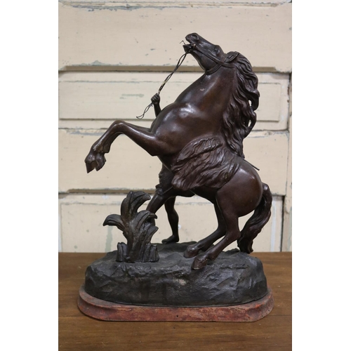 38 - After Guillaume Coustou, bronzed spelter figure of Marly Horse, on wooden base, approx 45cm H x 30cm... 
