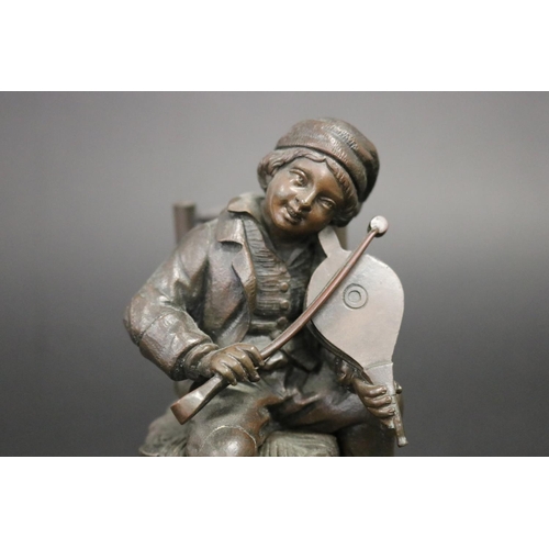 177 - Antique French or European bronze of a young boy playing bellows as a violin with coal nips, while s... 