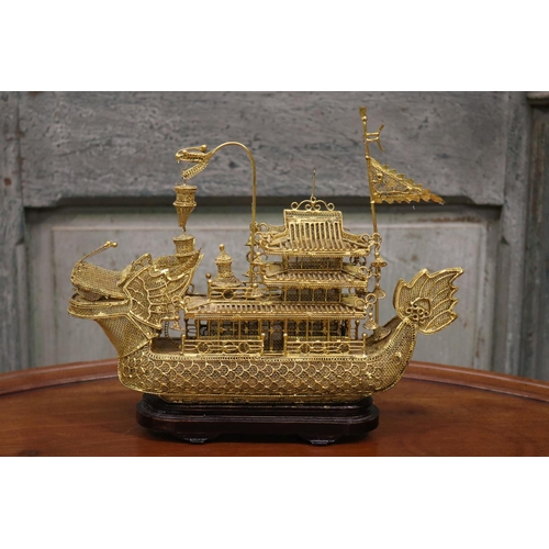 176 - Brass wire work decorative dragon boat on stand, approx 26cm H including stand x 30cm L