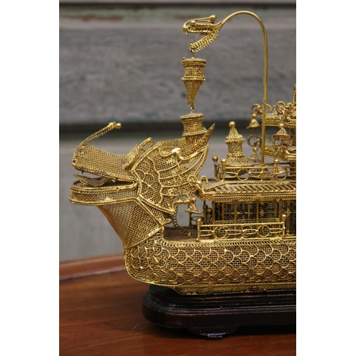 176 - Brass wire work decorative dragon boat on stand, approx 26cm H including stand x 30cm L