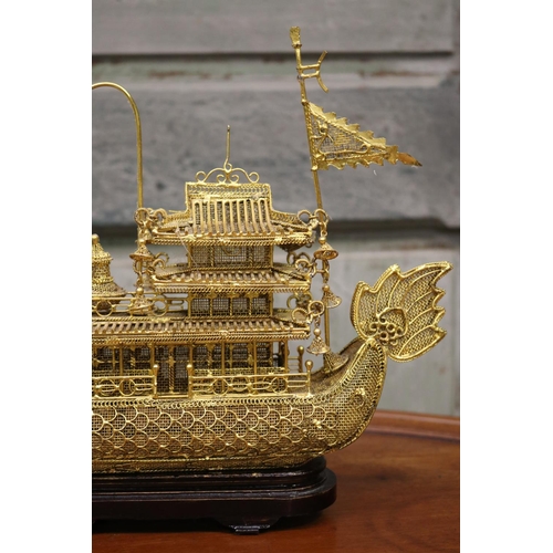 176 - Brass wire work decorative dragon boat on stand, approx 26cm H including stand x 30cm L