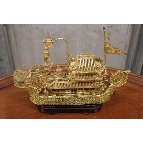 176 - Brass wire work decorative dragon boat on stand, approx 26cm H including stand x 30cm L