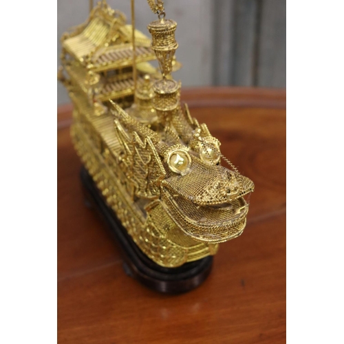 176 - Brass wire work decorative dragon boat on stand, approx 26cm H including stand x 30cm L