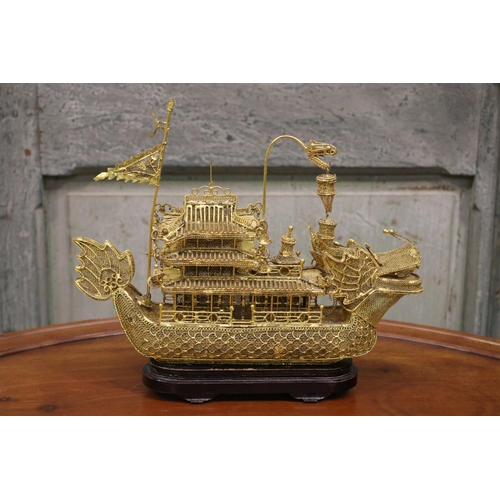 176 - Brass wire work decorative dragon boat on stand, approx 26cm H including stand x 30cm L