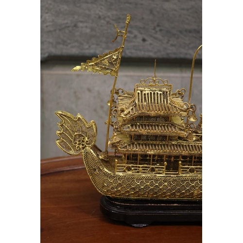 176 - Brass wire work decorative dragon boat on stand, approx 26cm H including stand x 30cm L