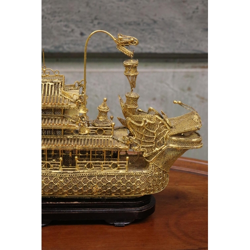 176 - Brass wire work decorative dragon boat on stand, approx 26cm H including stand x 30cm L