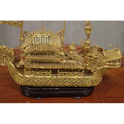 176 - Brass wire work decorative dragon boat on stand, approx 26cm H including stand x 30cm L