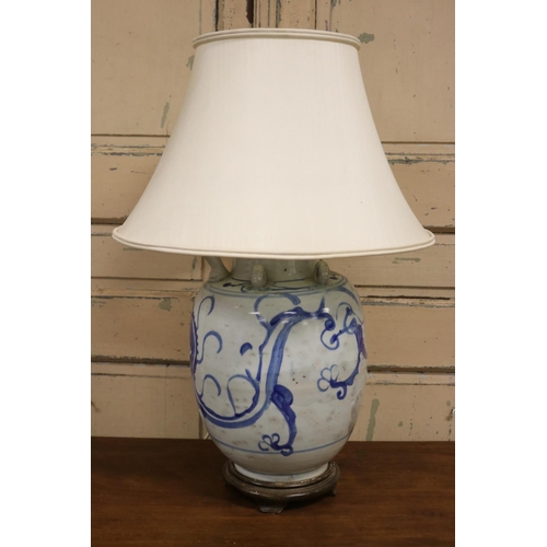 73 - Antique Asian blue and white pottery oil pot lamp with wooden base and light shade, approx 67cm H