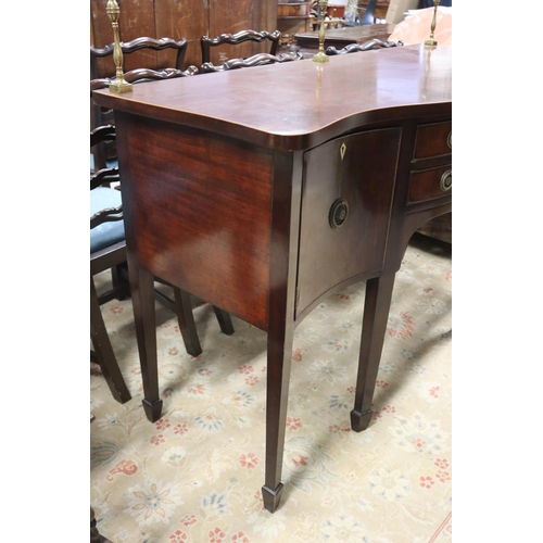 570 - Antique Georgian mahogany revival shaped front sideboard, fitted with brass back rail, all standing ... 