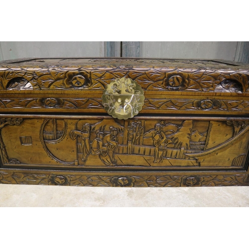 609 - Vintage Chinese carved camphor wood trunk, with brass front latch plate, approx 38cm H x 89cm L x 41... 