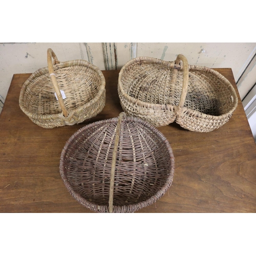 633 - Three cane baskets, approx 39cm L and smaller (3)