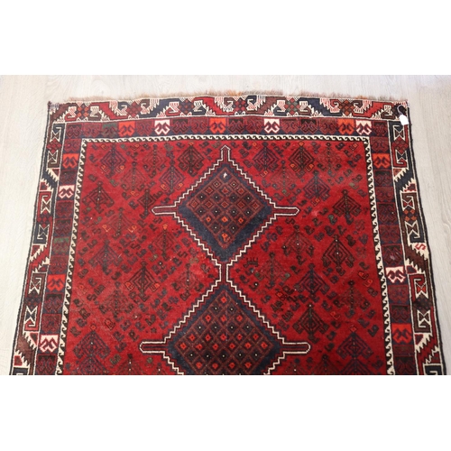 643 - Iranian hand knotted wool carpet, of red ground, approx 193cm x 142cm