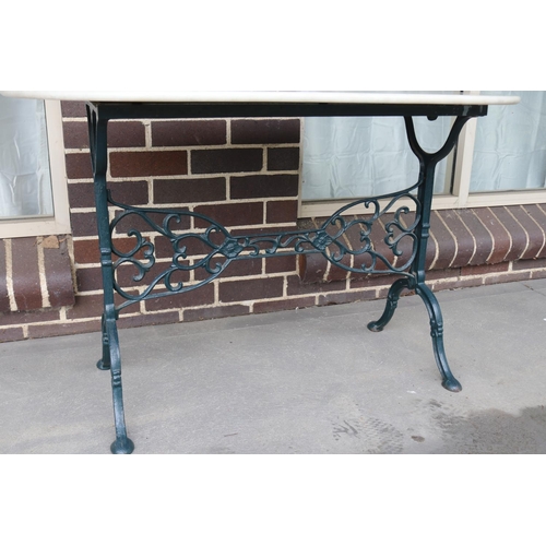 531 - Cast iron based Marble top garden table, approx 74cm H x 120cm W x 60cm D