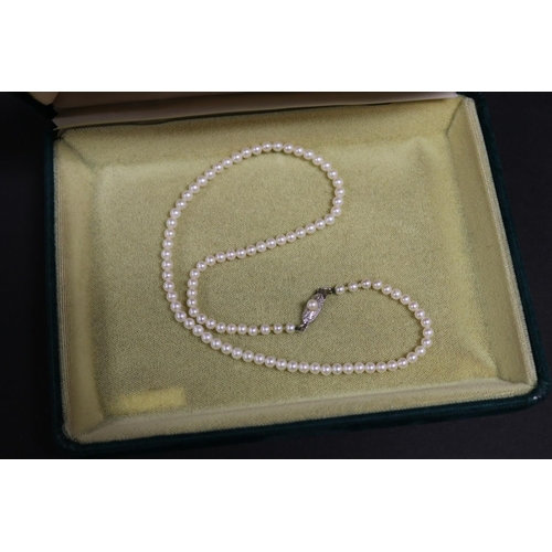 280 - Mikimoto graduated pearl necklace with silver clasp in box