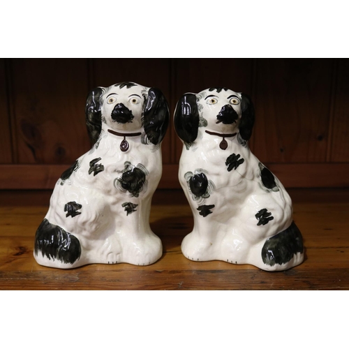 50 - Pair of black & white Staffordshire dogs (Please note one is about to fall apart), each approx 20cm ... 