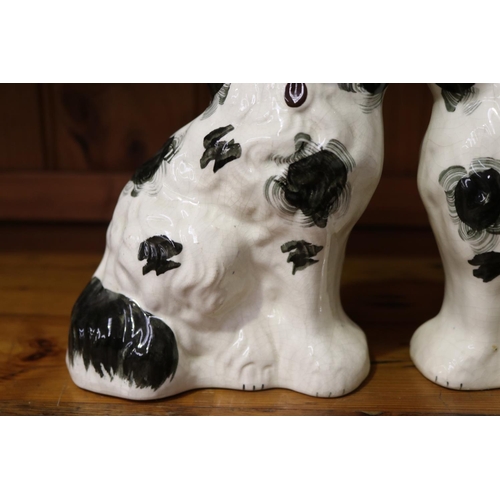50 - Pair of black & white Staffordshire dogs (Please note one is about to fall apart), each approx 20cm ... 
