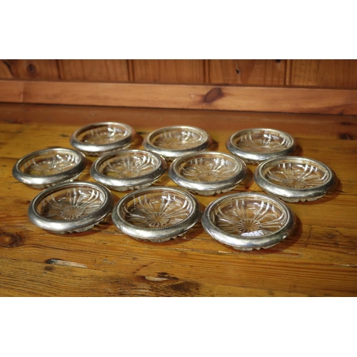 82 - Set of ten Italian silver plate pressed glass trays/coasters, each approx 10cm dia (10)
