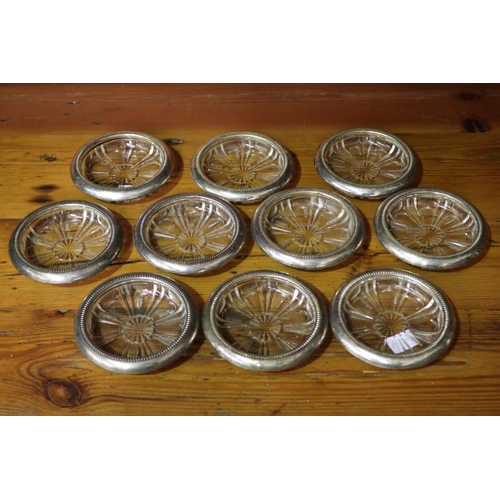 82 - Set of ten Italian silver plate pressed glass trays/coasters, each approx 10cm dia (10)