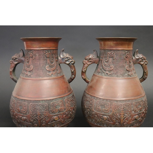 102 - Pair of Chinese twin handle copper finished metal vases, each approx 31cm H (2)