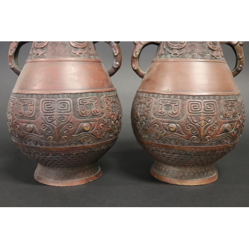 102 - Pair of Chinese twin handle copper finished metal vases, each approx 31cm H (2)