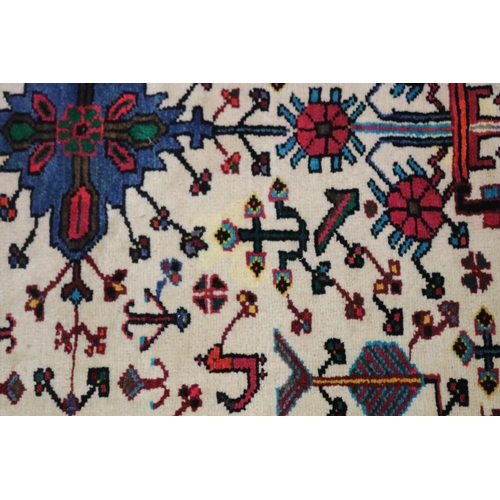 713 - Oriental wool carpet, hand woven with birds and animals, approx 102cm x 165cm