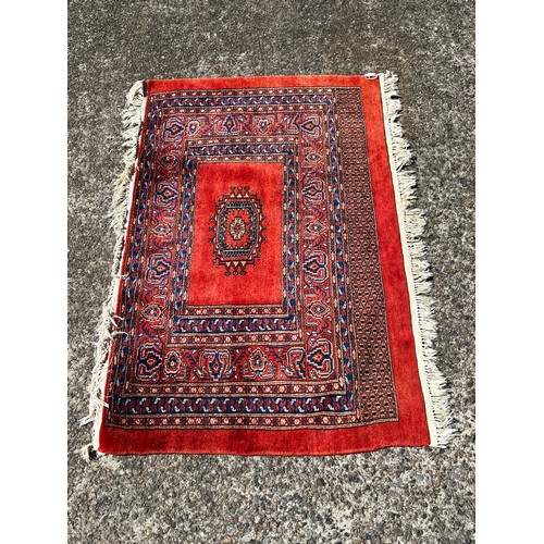 728 - Fine weave hand knotted wool carpet, red ground, approx 130 cm x 86 cm