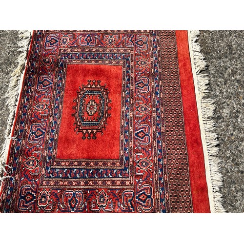 728 - Fine weave hand knotted wool carpet, red ground, approx 130 cm x 86 cm