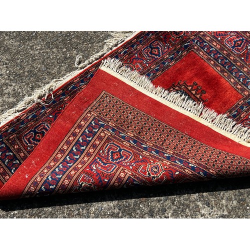 728 - Fine weave hand knotted wool carpet, red ground, approx 130 cm x 86 cm