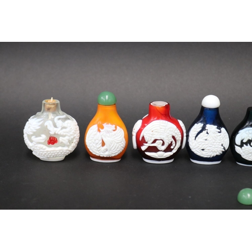 802 - Eleven Chinese Peking over lay glass snuff bottles, approx 7cm H and shorter (11)