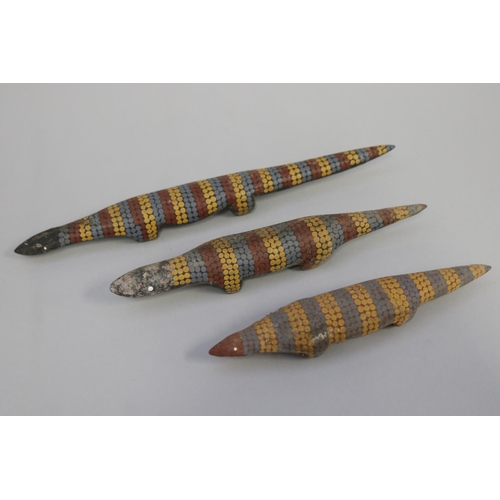 825 - Lisa Pultara (c1959-.) Australia (Aboriginal) three hand painted wood lizards (3)