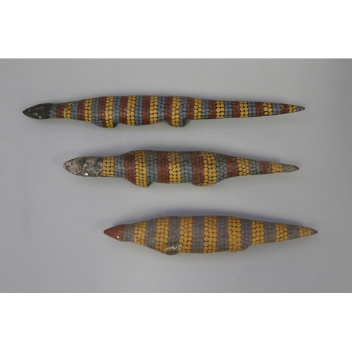 825 - Lisa Pultara (c1959-.) Australia (Aboriginal) three hand painted wood lizards (3)