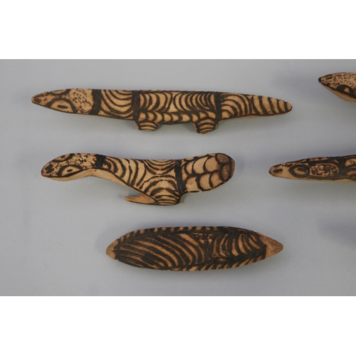 827 - Lisa Pultara - Aboriginal-Australian (Circa 1961) Six poker work carved lizards  longest 32.5 cm (6)