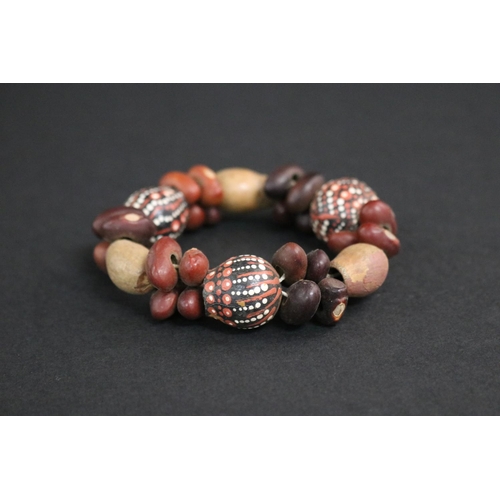 828 - Lisa Pultara (c1959-.) Australia (Aboriginal deceased) Painted bracelet, bean tree & gumnut, 87, Anm... 