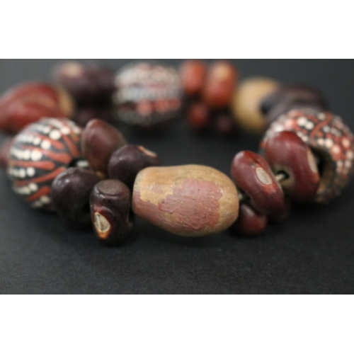 828 - Lisa Pultara (c1959-.) Australia (Aboriginal deceased) Painted bracelet, bean tree & gumnut, 87, Anm... 