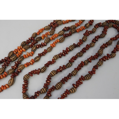 829 - Two similar length long Aboriginal poker worked bead and bean necklaces (2) circa 1980's  Napperby s... 