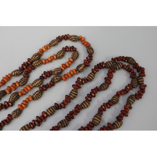 829 - Two similar length long Aboriginal poker worked bead and bean necklaces (2) circa 1980's  Napperby s... 