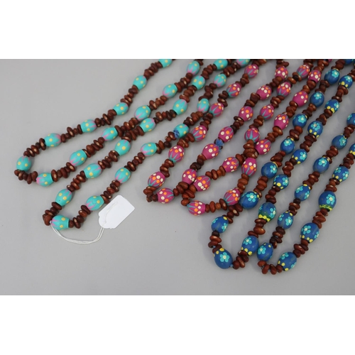 836 - Three long length colorful Australian Aboriginal painted gum nut and bead necklaces (3) circa 1980's... 