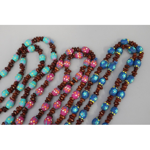 836 - Three long length colorful Australian Aboriginal painted gum nut and bead necklaces (3) circa 1980's... 