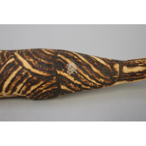 845 - Bobby Tilmouth (1942-.) Australia (Aboriginal), two carved pokerwork lizards, 34 cm & 28.5 cm  (2)